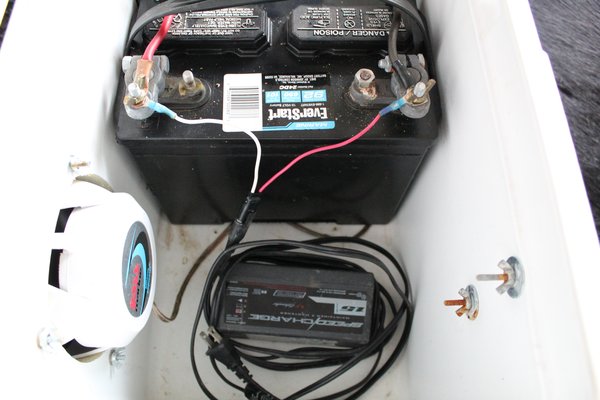An image of the tricle charger wired to the battery.